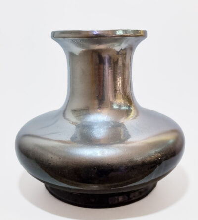 Ceramic vase with silver color and black base