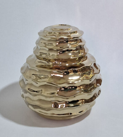 Ceramic vase in gold color