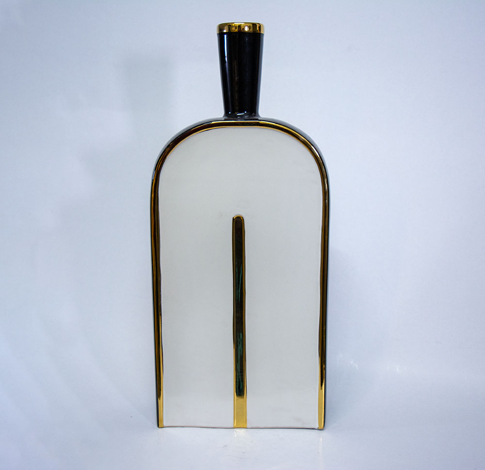 White ceramic vase with gold and black details